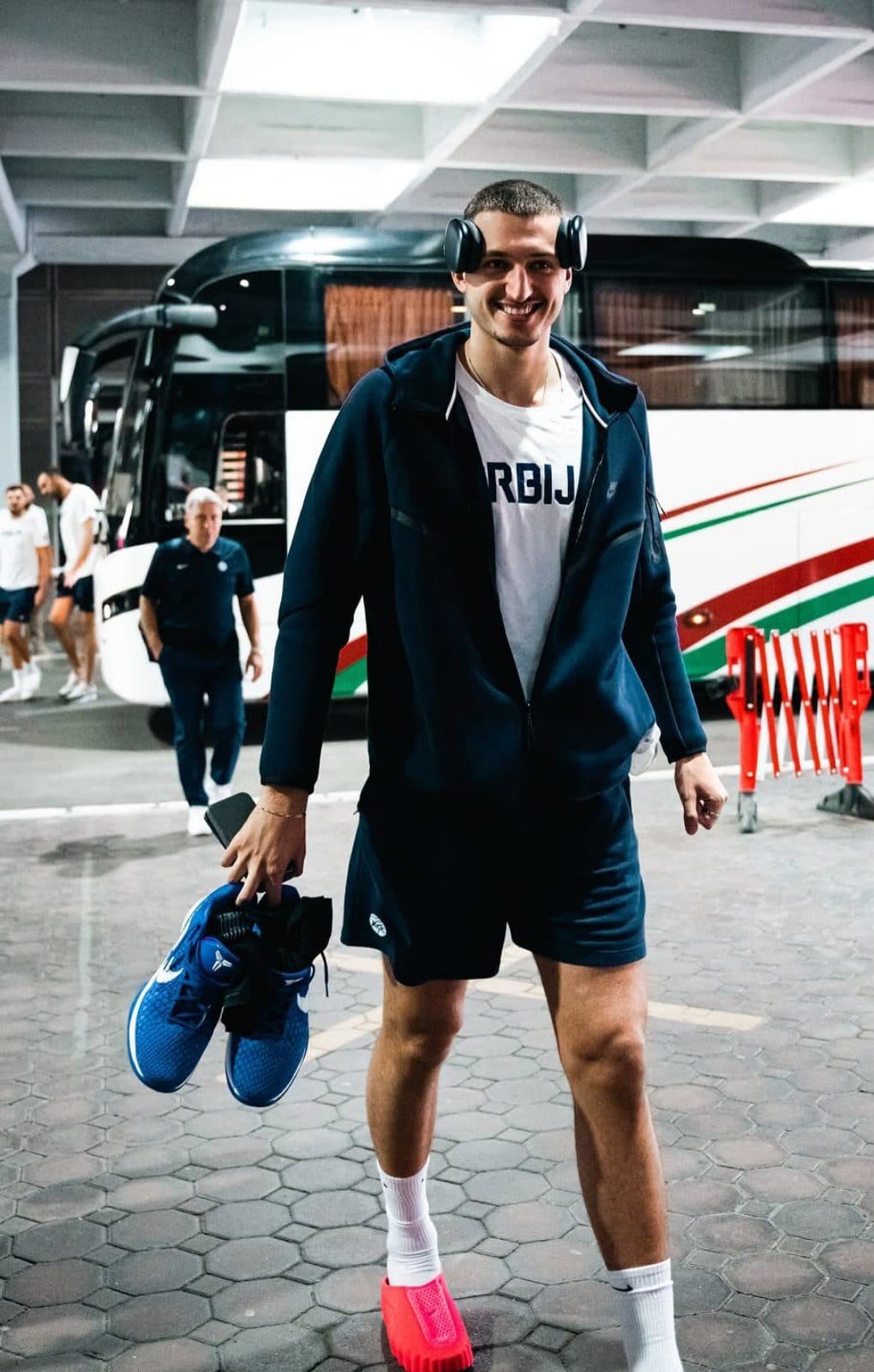 Serbian national team player with headphones in front of the coach
